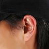 Ear tattoo piercing for yoga practice.