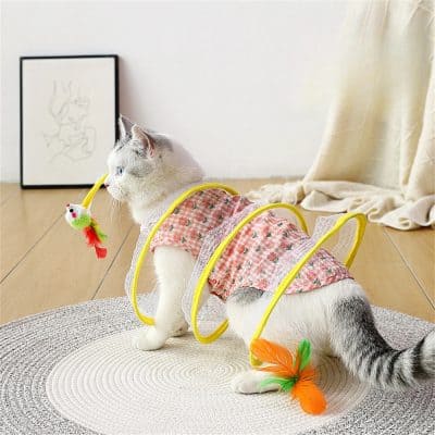 Adorable pet harness with colorful feather toy, perfect for cats or small animals, designed for comfort and play, available at Monalisa Medical Store.