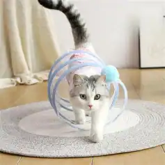 Cute cat exploring transparent pet tunnel with blue pom-pom, perfect for indoor pet entertainment and enrichment, from Monalisa Store.