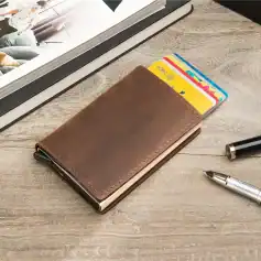 An elegant brown leather wallet holding colorful credit cards placed on a light wooden surface. Perfect for organizing essentials, ideal for professionals and travelers to keep their cards secure and accessible.