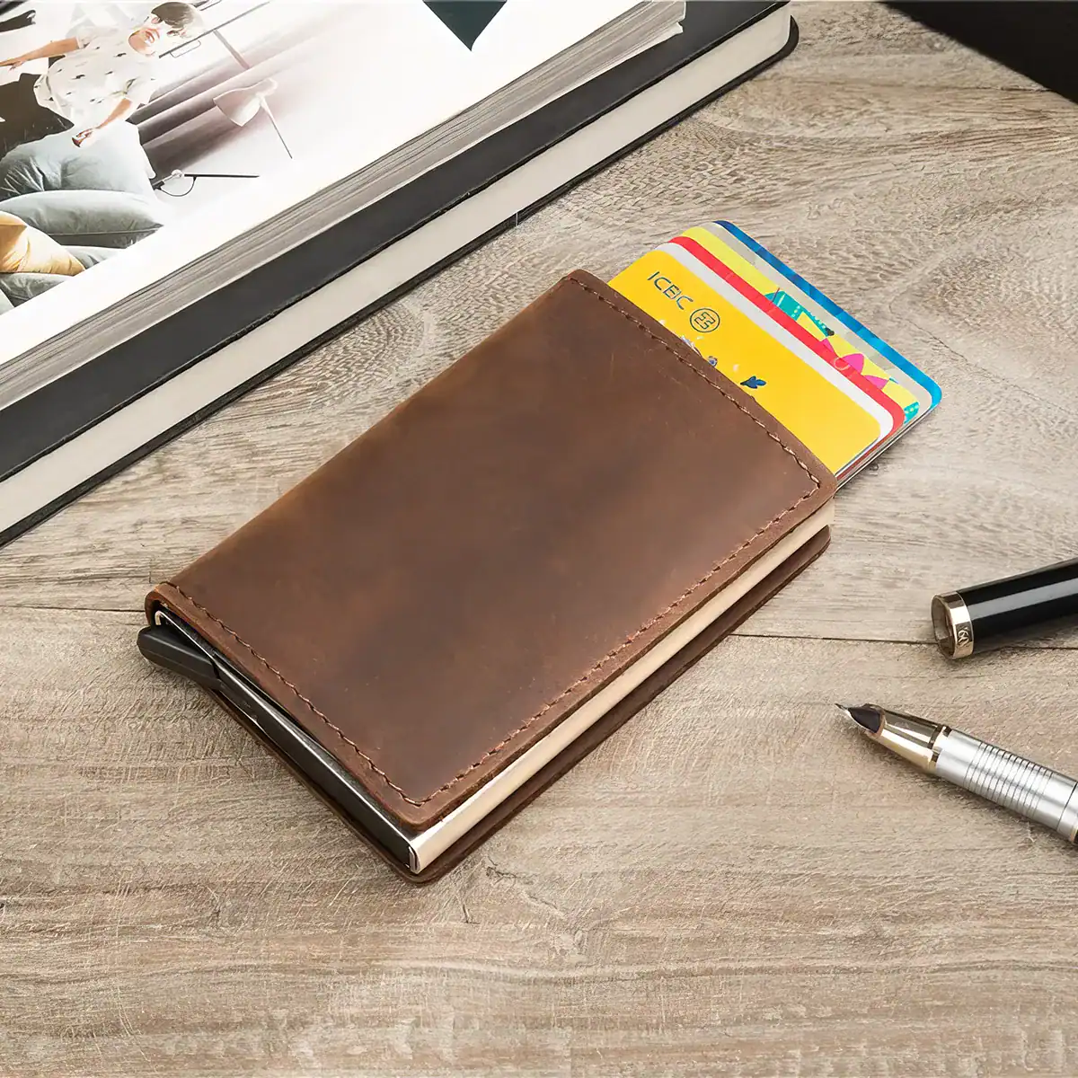 An elegant brown leather wallet holding colorful credit cards placed on a light wooden surface. Perfect for organizing essentials, ideal for professionals and travelers to keep their cards secure and accessible.