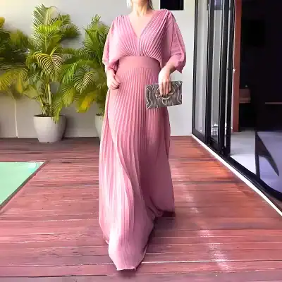 Stylish pink pleated maxi dress perfect for formal occasions, weddings, or upscale events, showcasing sophisticated design and comfortable fit.