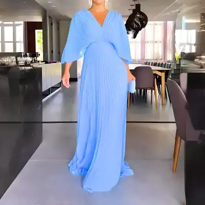 Long blue pleated dress with flowing fabric and bell sleeves, perfect for formal occasions and evening wear.