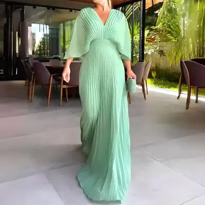 Luxurious mint green pleated maxi dress, perfect for upscale occasions and stylish appearances. Features flowing fabric and sophisticated design from Monalisa Medical Store.