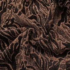Elegant animal print fabric featuring black and bronze tones with shimmering glitter details, perfect for stylish fashion or interior decor.