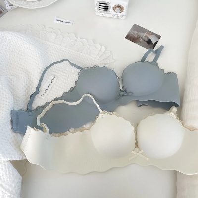 Bright, clean retail setting showcasing blue and cream bras with delicate lace accents on display. The store offers high-quality women's lingerie, focusing on comfort and style with a welcoming, modern atmosphere.