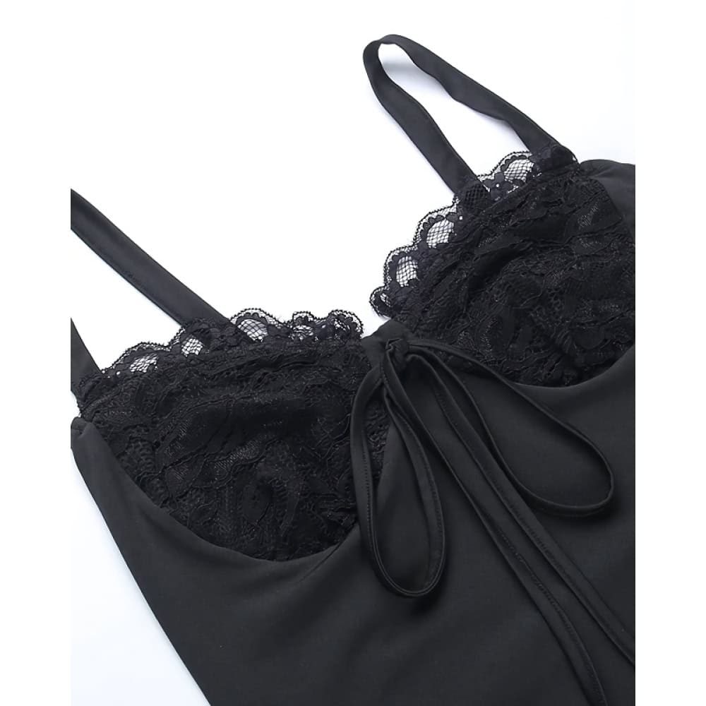 Luxurious black dress featuring delicate lace accents and a chic bow tied at the front, perfect for fashionable occasions and stylish wardrobing.