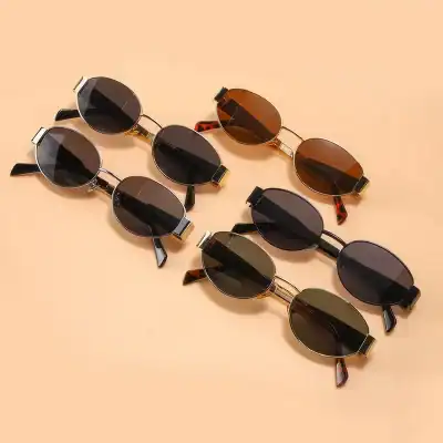 A trendy variety of sunglasses displayed on a pastel background, featuring different frame styles and lens shades, ideal for fashion-forward individuals seeking high-quality eyewear from Monalisa Store.