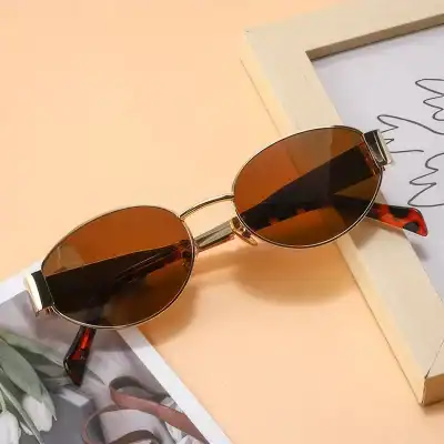 Chic brown-tinted sunglasses with sleek metal frame and tortoise-shell arms, ideal for summer and everyday wear.