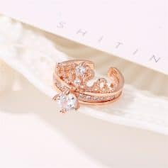Beautiful rose gold crown ring adorned with sparkling diamonds, perfect for special occasions or everyday elegance. Features intricate design and high-quality craftsmanship from Monalisa Store.