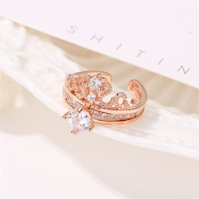Beautiful rose gold crown ring adorned with sparkling diamonds, perfect for special occasions or everyday elegance. Features intricate design and high-quality craftsmanship from Monalisa Store.