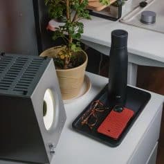 High-quality workspace setup featuring modern tech, a potted plant, and accessories for a professional environment. Perfect for maximizing productivity and aesthetic appeal.