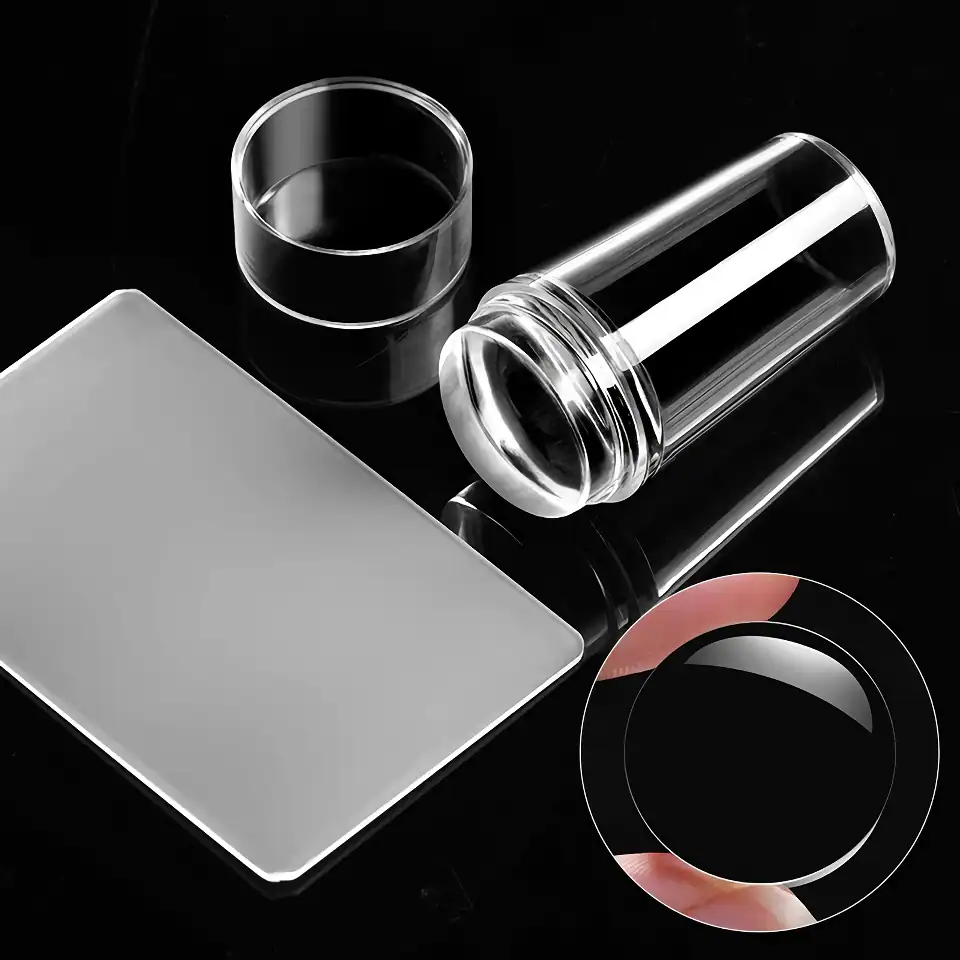 Clear glass laboratory containers and dish.