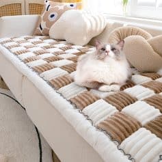 Soft, plush pet bed with warm, textured blankets and cushions, perfect for cats to relax comfortably at home. Stylish, inviting, and designed for feline comfort.