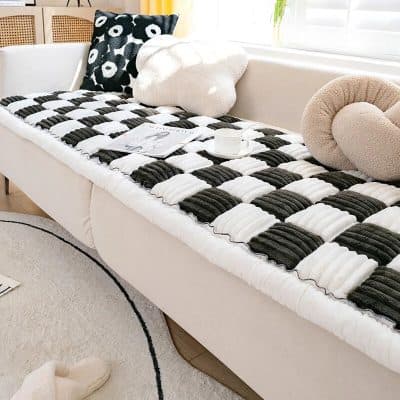 Luxurious black and white bed cover with plush pillows for comfortable sleep and room decor, perfect for bedroom makeover and relaxation.