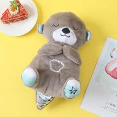 Soft plush otter toy with musical sound, perfect for kids’ comfort and entertainment, designed with a cuddly texture and charming details for children's play and sleep.