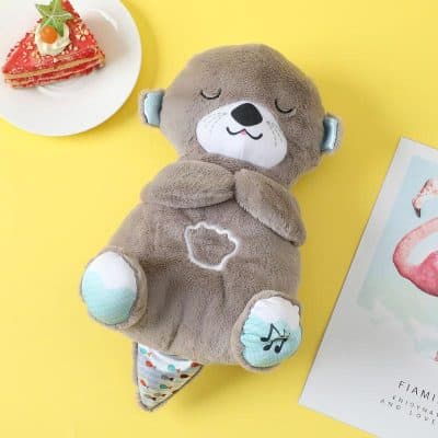 Soft plush otter toy with musical sound, perfect for kids’ comfort and entertainment, designed with a cuddly texture and charming details for children's play and sleep.