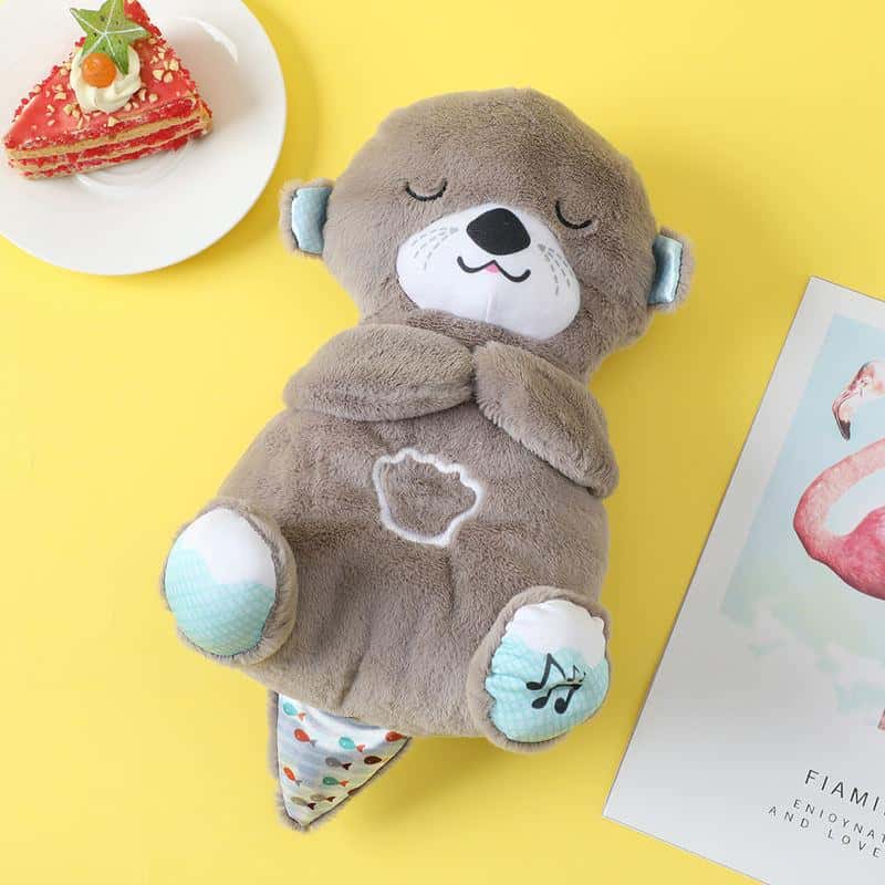 Soft plush otter toy with musical sound, perfect for kids’ comfort and entertainment, designed with a cuddly texture and charming details for children's play and sleep.