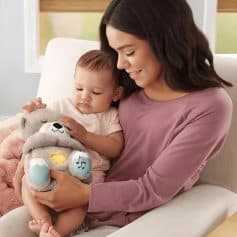 Soft, comforting plush toy for kids with lights and sounds to aid learning and sensory development.