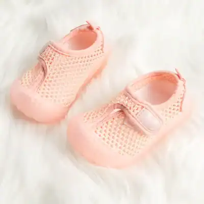Delicate pink mesh baby shoes with secure Velcro straps, perfect for newborns and infants. Breathable, comfortable, and stylish footwear for delicate feet.