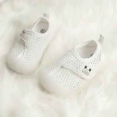 White infant baby shoes with breathable mesh material and easy slip-on design, suitable for newborns and toddlers, offering comfort and style for everyday wear.
