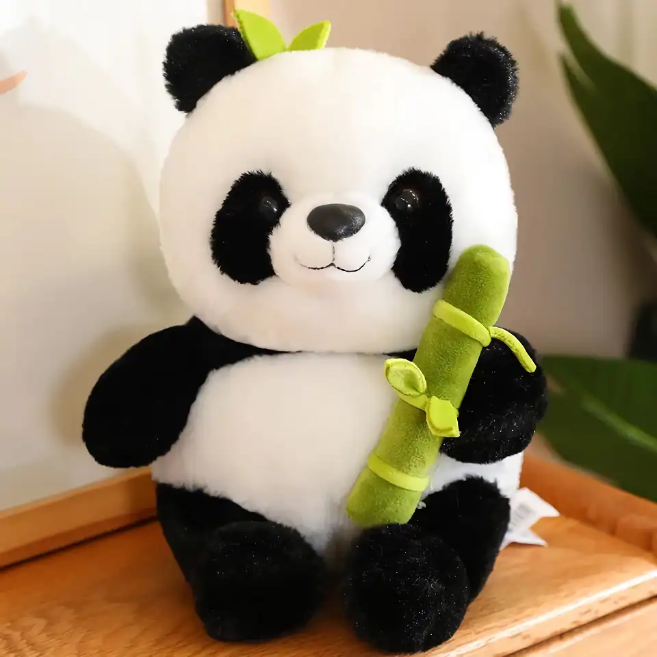 Adorable panda plush toy holding a green bamboo stalk, perfect for kids, gifts, and home decor. Soft, cuddly, and high-quality material for children and collectors alike.