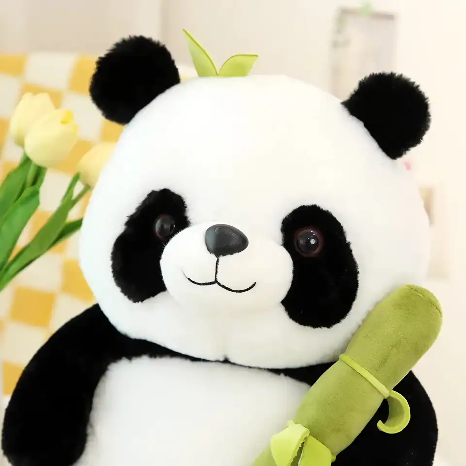 Adorable panda plush toy holding a bamboo shoot, perfect for children and panda lovers. Soft, cuddly, and charming, ideal for gift or decorative purposes.