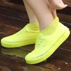 Vivid yellow slip-on sneakers with breathable material, comfortable sole, perfect for casual wear and active lifestyles.