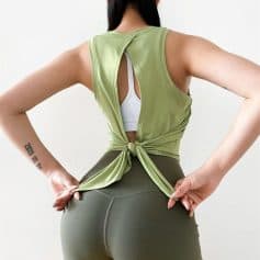 Stylish open-back sports top for women, perfect for gym workouts and yoga. Breathable, comfortable, and fashionable activewear ideal for fitness enthusiasts.