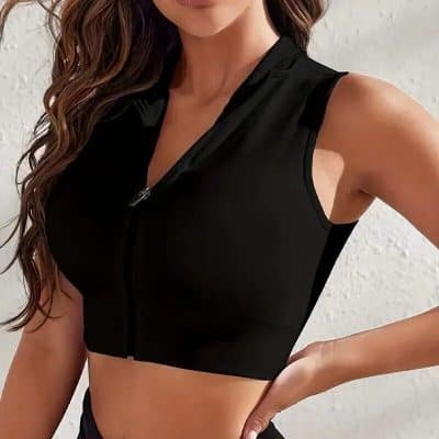 Comfortable black zip-up athletic crop top for women, perfect for workout or casual wear.