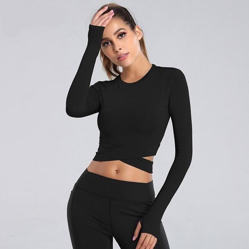 High-quality black crop top with long sleeves, perfect for trendy fashion and everyday wear. Comfortable fit for all-day use, ideal for casual outfits or fitness activities.