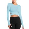 High-quality blue crop top with cutout design, perfect for modern women seeking trendy, comfortable, and fashionable clothing options. Ideal for casual outings and stylish looks.