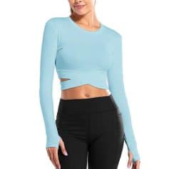High-quality blue crop top with cutout design, perfect for modern women seeking trendy, comfortable, and fashionable clothing options. Ideal for casual outings and stylish looks.