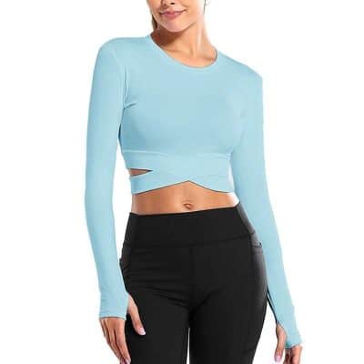 High-quality blue crop top with cutout design, perfect for modern women seeking trendy, comfortable, and fashionable clothing options. Ideal for casual outings and stylish looks.