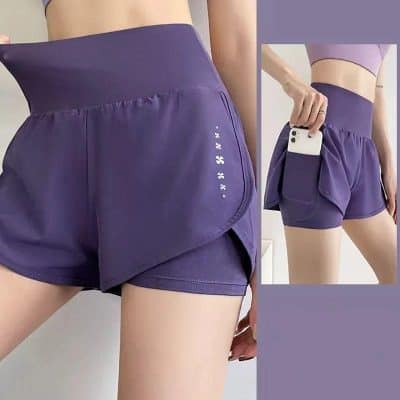 High-waisted purple athletic shorts with side pocket for phone storage, perfect for running, yoga, or gym workouts. Stylish, lightweight, and breathable workout apparel for women.
