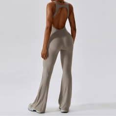Comfortable, sleek jumpsuit with open back, ideal for fitness or casual wear. Perfect fit, breathable fabric, trendy design for active lifestyles.
