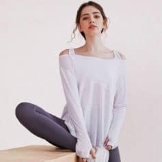 Comfortable white yoga top for women, perfect for activewear and lounging, lightweight and breathable, suitable for fitness and casual wear.