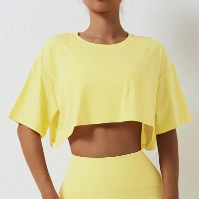 Bright yellow crop top for women, perfect for activewear, yoga, or casual outings. Comfortable, stylish, and lightweight for all-day wear.