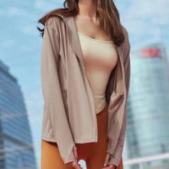 A trendy beige women's jacket showcased outdoors in an urban setting, perfect for fashion-forward women seeking high-quality outerwear available at Monalisa Store.
