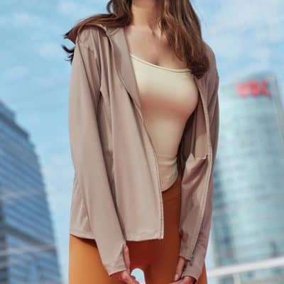 A trendy beige women's jacket showcased outdoors in an urban setting, perfect for fashion-forward women seeking high-quality outerwear available at Monalisa Store.