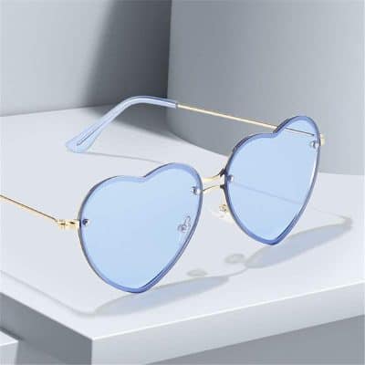 Stylish blue heart-shaped sunglasses with gold accents, perfect for fashion-forward eyewear lovers. Durable and UV-protective, ideal for summer or casual wear.