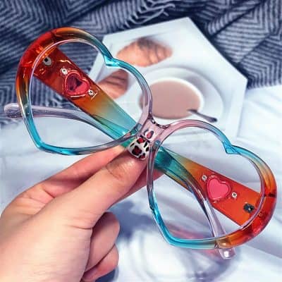 Vibrant, heart-shaped sunglasses with multi-colored frames featuring decorative accents, ideal for stylish eyewear shoppers at Monalisa Store.