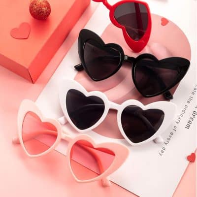 Colorful heart-shaped sunglasses with dark lenses, perfect for fashion-forward women. Shop stylish optical eyewear at Monalisa Store for trendy, high-quality sunglasses.