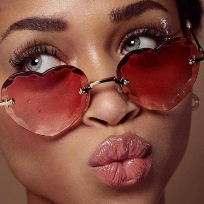 Voguish heart-shaped sunglasses with red tinted lenses and metal frames, ideal for summer fashion. These trendy sunglasses offer UV protection and are perfect for women seeking stylish accessories. Available at Monalisa Store, the top destination for fashionable eyewear.