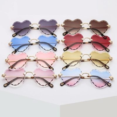 Colorful heart-shaped sunglasses with stylish frames, perfect for trendy eyewear enthusiasts and fashionable accessories. Ideal for sun protection, summer fashion, and making a bold style statement.