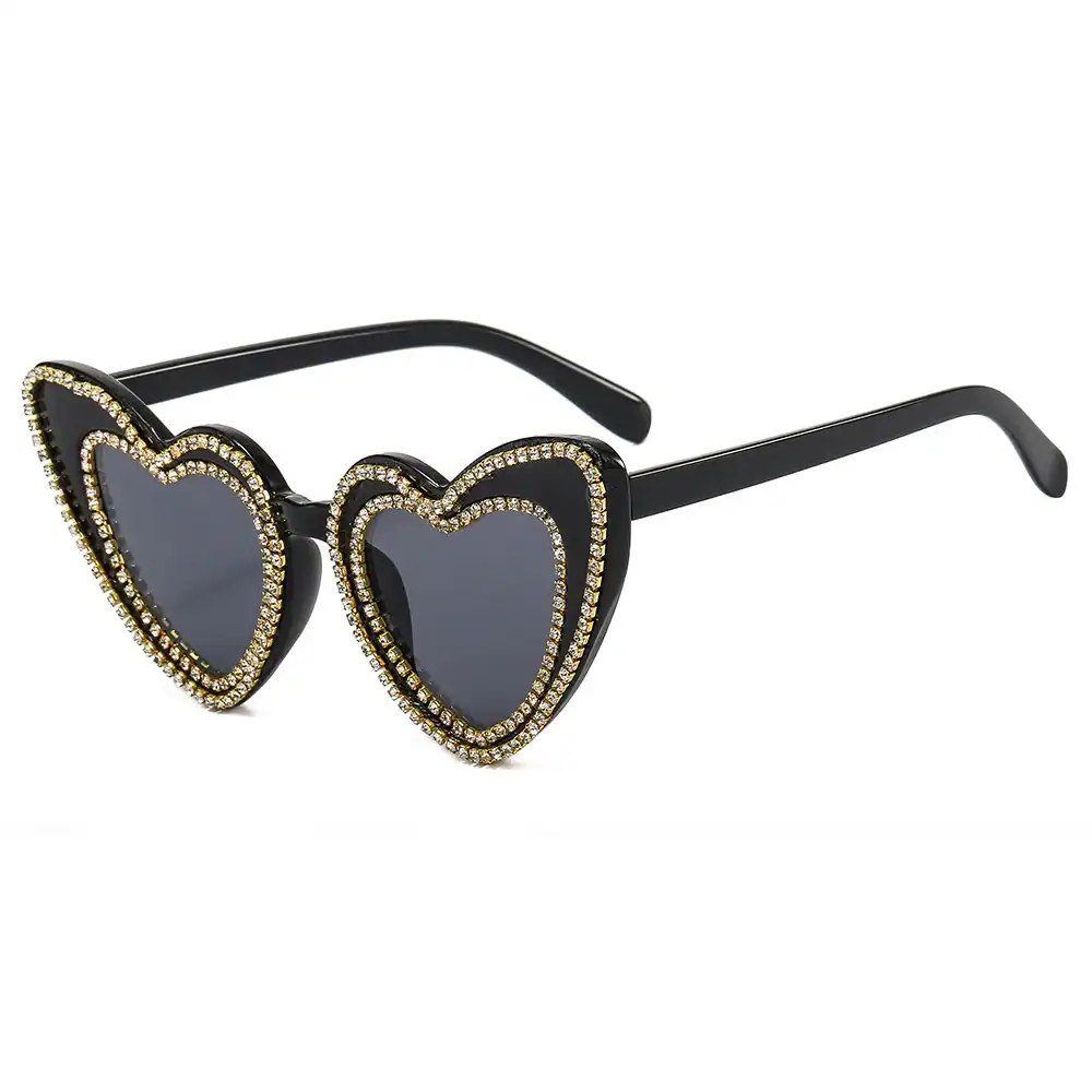 Glamorous heart-shaped sunglasses decorated with rhinestones, ideal for fashion accessories, statement eyewear, and trendy sunglasses collection.