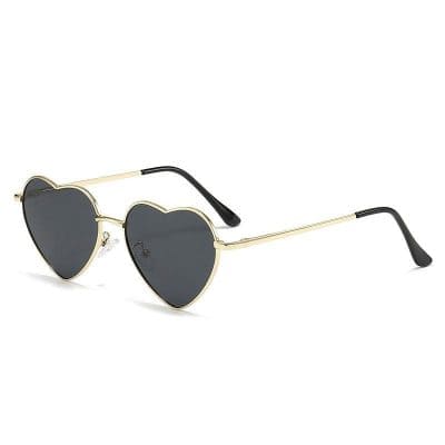 Stylish heart-shaped sunglasses with black lenses and gold frames, perfect for fashion-forward eyewear lovers seeking a unique accessory. Ideal for women’s summer sunglasses.