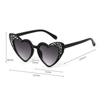 Fashionable heart-shaped sunglasses with rhinestone embellishments, perfect for women seeking trendy eyewear options. Accurate measurements provided for the ideal fit and style.