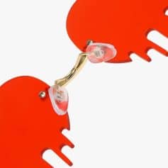 Colorful heart-shaped statement jewelry with gold accents, perfect for stylish accessories and special occasions.