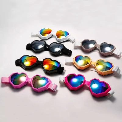 Heart-shaped LED sunglasses with vibrant, multi-color lenses and adjustable straps, suitable for parties, festivals, and celebrations. Durable, lightweight, and trending accessories that add fun and style to any event or outfit.